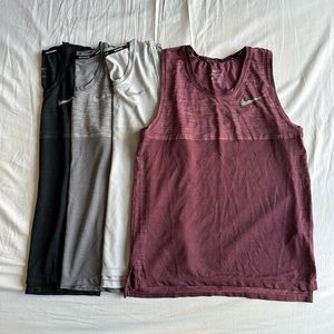 4 pack small Nike running tank tops